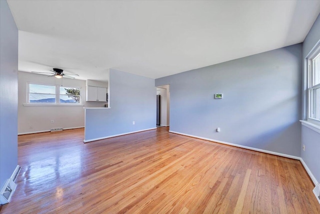 3734 Long Meadow Ave NW, Roanoke, VA 24017 - spare room with ceiling fan, light wood-style floors, baseboards, and baseboard heating