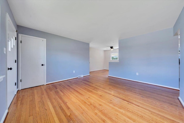 3734 Long Meadow Ave NW, Roanoke, VA 24017 - empty room with light wood-style floors, a ceiling fan, and baseboards