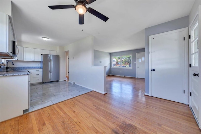 3734 Long Meadow Ave NW, Roanoke, VA 24017 - kitchen featuring stainless steel appliances, a ceiling fan, light wood-type flooring, white cabinets, and open floor plan
