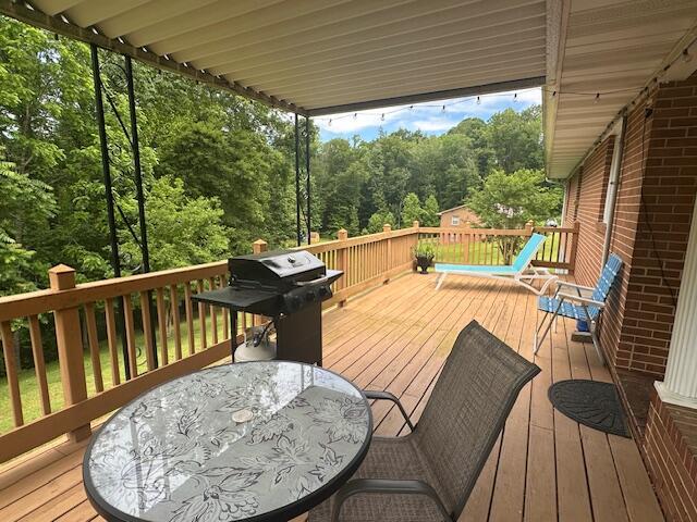 586 Graceland Dr, Bassett, VA 24055 - deck featuring outdoor dining area and grilling area