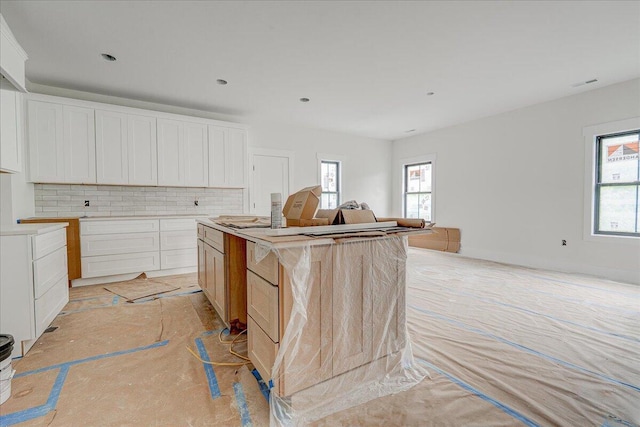 1037 Westerham Ct, Huddleston, VA 24104 - kitchen with healthy amount of natural light, backsplash, open floor plan, a kitchen island, and recessed lighting