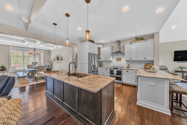 700 Thornblade Way, Blue Ridge, VA 24064 - kitchen featuring a sink, wall chimney exhaust hood, stainless steel appliances, open floor plan, and a kitchen bar