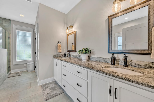 700 Thornblade Way, Blue Ridge, VA 24064 - bathroom with double vanity, a shower stall, baseboards, healthy amount of natural light, and recessed lighting