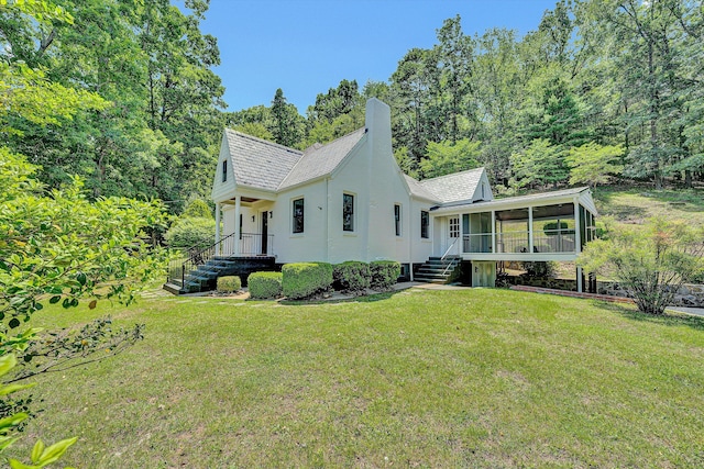 4816 Colonial Ave, Roanoke, VA 24018 - view of front of home with a sunroom, a front lawn, and a chimney