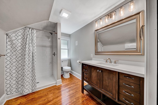 4816 Colonial Ave, Roanoke, VA 24018 - bathroom with toilet, vanity, a tile shower, wood finished floors, and baseboards
