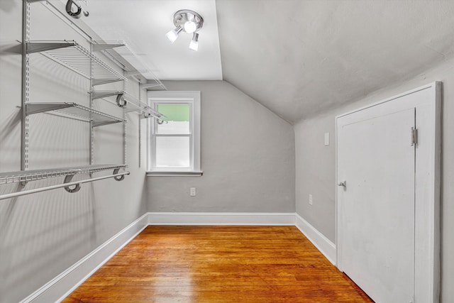 4816 Colonial Ave, Roanoke, VA 24018 - additional living space with lofted ceiling, wood finished floors, and baseboards