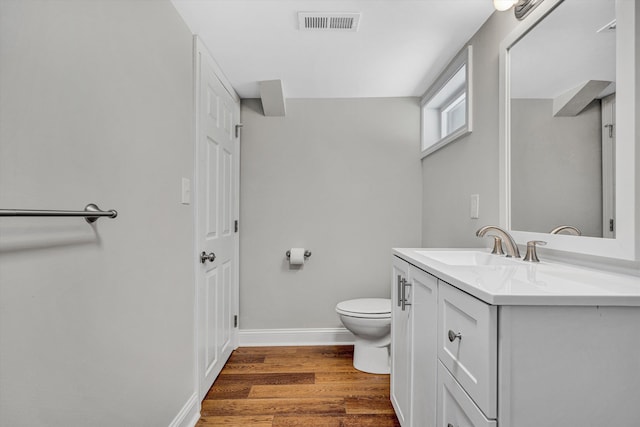 4816 Colonial Ave, Roanoke, VA 24018 - bathroom with toilet, vanity, wood finished floors, and baseboards
