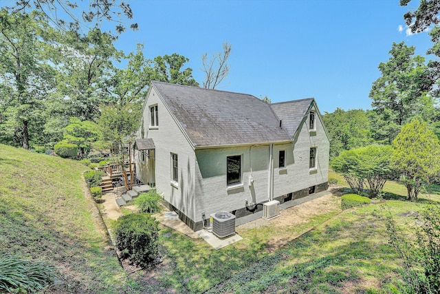 4816 Colonial Ave, Roanoke, VA 24018 - view of side of home featuring central AC unit, a yard, a shingled roof, and a wooden deck