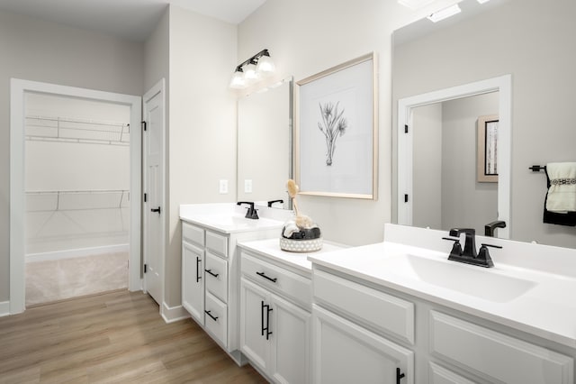 7272 Fairway Ridge Cir, Salem, VA 24153 - bathroom featuring wood finished floors, vanity, and a spacious closet
