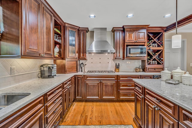 402 Anchor Dr, Moneta, VA 24121 - kitchen with wall chimney range hood, stainless steel appliances, pendant lighting, light stone counters, and decorative backsplash
