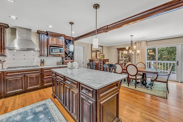402 Anchor Dr, Moneta, VA 24121 - kitchen with wall chimney exhaust hood, stainless steel appliances, light wood-style floors, backsplash, and ornamental molding