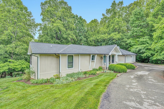402 Anchor Dr, Moneta, VA 24121 - view of front of home featuring driveway, a garage, a front lawn, and roof with shingles