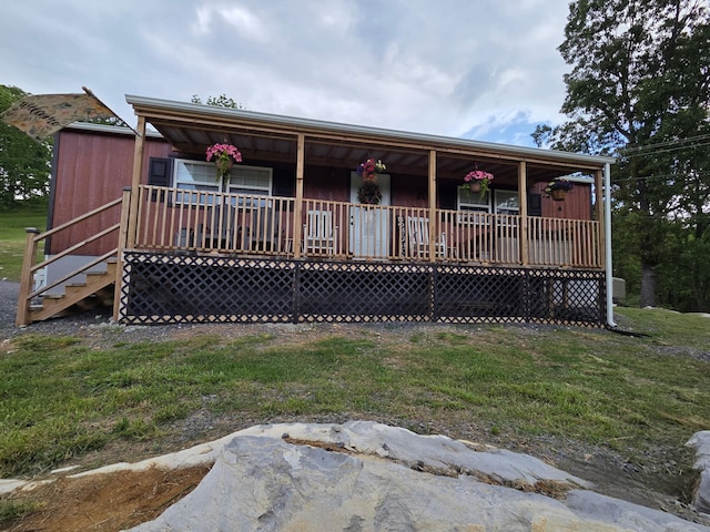 7506 Roaring Run Rd Unit 1, Covington, VA 24426 - view of front facade featuring a porch and a front yard