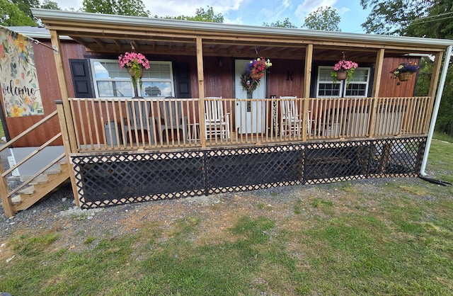 7506 Roaring Run Rd Unit 1, Covington, VA 24426 - ranch-style house with a porch and a front lawn