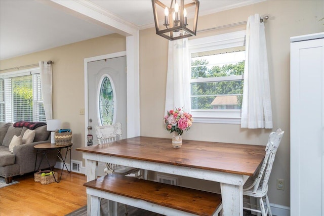 160 Mountain View Dr, Rocky Mount, VA 24151 - dining room with healthy amount of natural light, a chandelier, crown molding, and wood finished floors