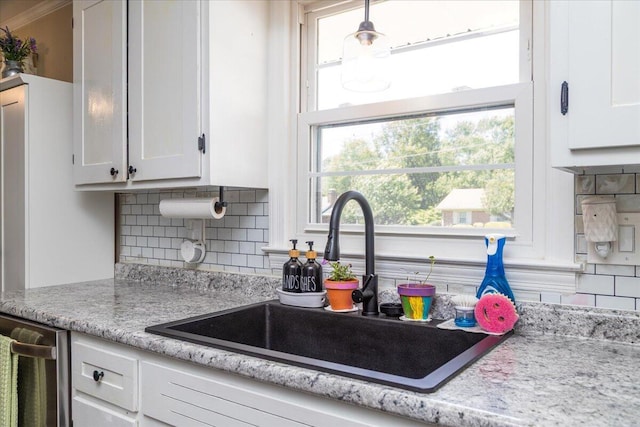 160 Mountain View Dr, Rocky Mount, VA 24151 - kitchen with a sink, decorative backsplash, white cabinetry, dishwasher, and light stone counters