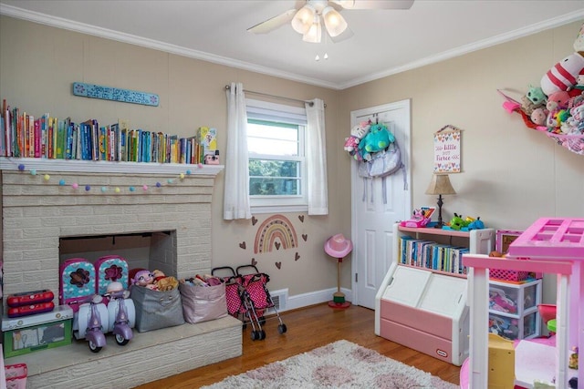 160 Mountain View Dr, Rocky Mount, VA 24151 - game room featuring ceiling fan, wood finished floors, ornamental molding, baseboards, and a fireplace