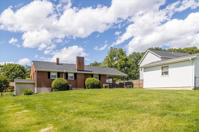 160 Mountain View Dr, Rocky Mount, VA 24151 - rear view of property featuring a chimney, brick siding, an attached carport, and central AC unit