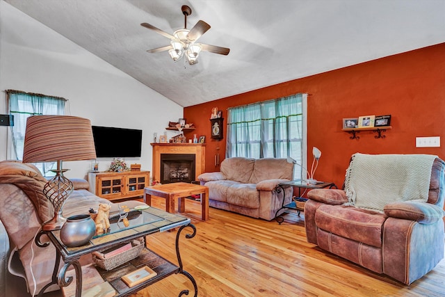 7123 Tall Oak Ln, Roanoke, VA 24018 - living area featuring a ceiling fan, light wood-style floors, vaulted ceiling, and a fireplace