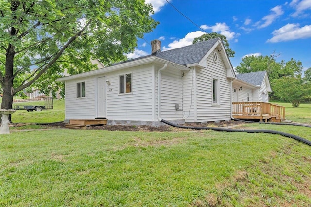 776 Camp N Rd, Salem, VA 24153 - view of property exterior featuring roof with shingles, a deck, a chimney, and a lawn