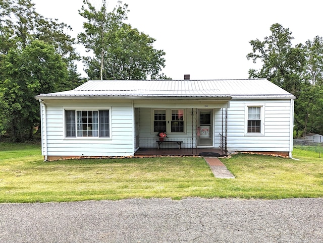 150 Harvey St, Rocky Mount, VA 24151 - view of front of home featuring covered porch, a front yard, and metal roof