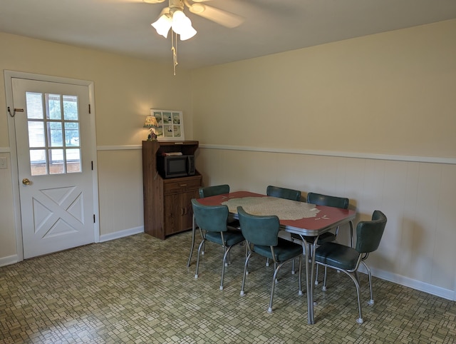 150 Harvey St, Rocky Mount, VA 24151 - dining space featuring a wainscoted wall and ceiling fan