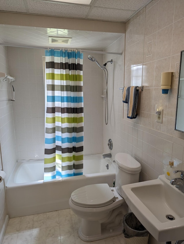 150 Harvey St, Rocky Mount, VA 24151 - bathroom with toilet, a sink, shower / tub combo with curtain, and tile walls