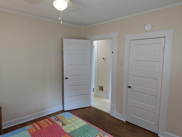 150 Harvey St, Rocky Mount, VA 24151 - unfurnished bedroom with dark wood-style floors, ornamental molding, and baseboards