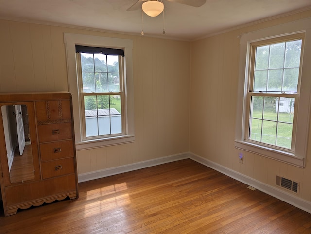 150 Harvey St, Rocky Mount, VA 24151 - empty room with plenty of natural light, light wood finished floors, baseboards, and crown molding