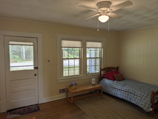 150 Harvey St, Rocky Mount, VA 24151 - bedroom with multiple windows, wood finished floors, crown molding, baseboards, and a ceiling fan