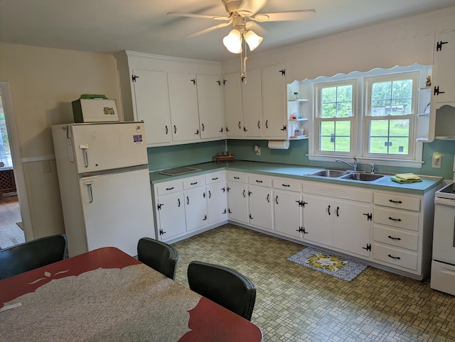 150 Harvey St, Rocky Mount, VA 24151 - kitchen with a sink, white appliances, a ceiling fan, and plenty of natural light