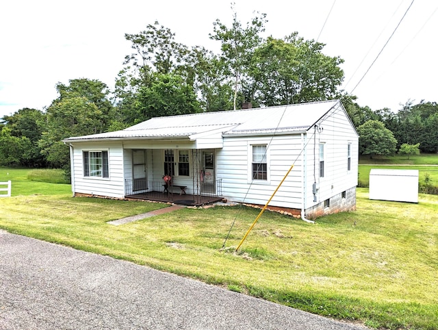150 Harvey St, Rocky Mount, VA 24151 - view of front of house featuring a porch, a front lawn, and metal roof