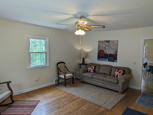 150 Harvey St, Rocky Mount, VA 24151 - living room featuring wood finished floors, a ceiling fan, and baseboards