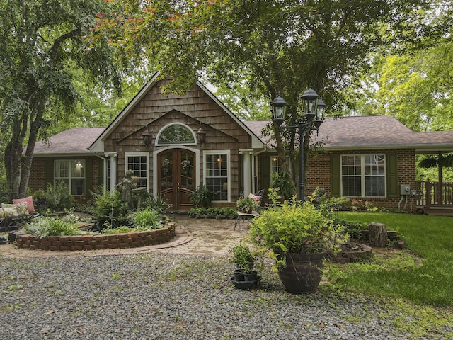 157 Burks Hollow Rd SW, Willis, VA 24380 - view of front of home featuring a shingled roof, brick siding, and french doors