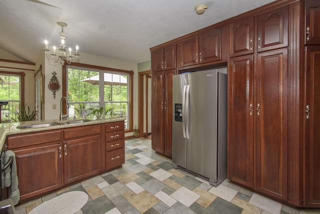 157 Burks Hollow Rd SW, Willis, VA 24380 - kitchen featuring stainless steel fridge with ice dispenser, a sink, a chandelier, light stone counters, and reddish brown cabinets