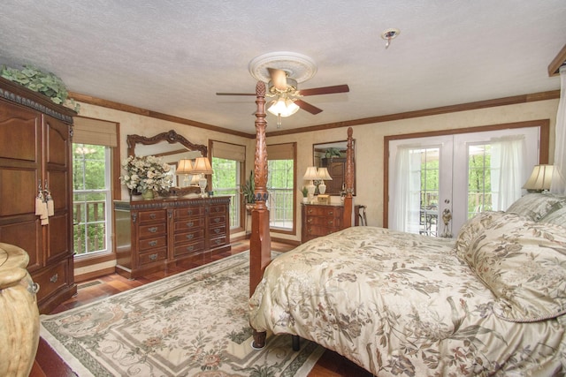 157 Burks Hollow Rd SW, Willis, VA 24380 - bedroom featuring french doors, access to outside, wood finished floors, multiple windows, and a textured ceiling