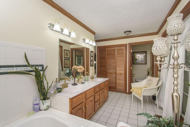 157 Burks Hollow Rd SW, Willis, VA 24380 - bathroom with double vanity, tile patterned floors, crown molding, a bath, and toilet
