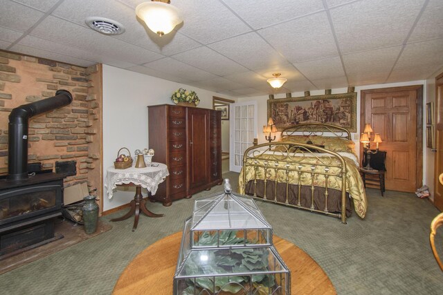 157 Burks Hollow Rd SW, Willis, VA 24380 - carpeted bedroom featuring a wood stove and a drop ceiling
