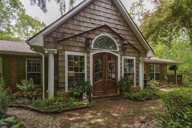 157 Burks Hollow Rd SW, Willis, VA 24380 - entrance to property with brick siding, french doors, and roof with shingles