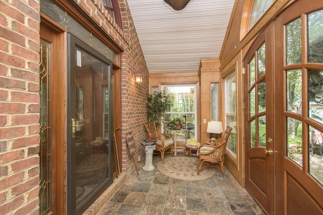 157 Burks Hollow Rd SW, Willis, VA 24380 - sunroom featuring stone finish floors, brick wall, and french doors