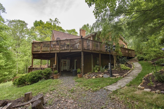 157 Burks Hollow Rd SW, Willis, VA 24380 - back of house featuring a wooden deck, a chimney, and brick siding