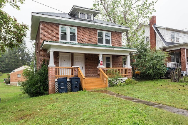 1627 Wayne St NE, Roanoke, VA 24012 - american foursquare style home featuring brick siding, a porch, and a front lawn
