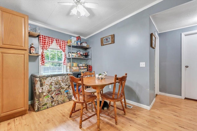 4362 Stewartsville Rd, Moneta, VA 24121 - dining room with ornamental molding, light wood-type flooring, vaulted ceiling, ceiling fan, and baseboards