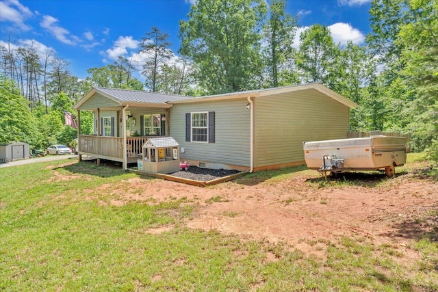 4362 Stewartsville Rd, Moneta, VA 24121 - rear view of house with a yard, a deck, and metal roof