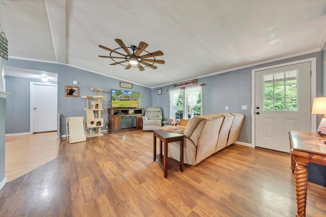 4362 Stewartsville Rd, Moneta, VA 24121 - living room with a fireplace, wood finished floors, ceiling fan, vaulted ceiling, and crown molding