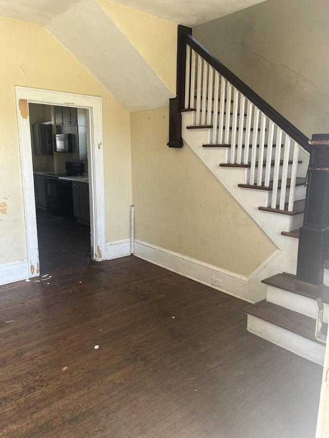 2816 10th St NW, Roanoke, VA 24012 - stairs with wood finished floors, lofted ceiling, and baseboards