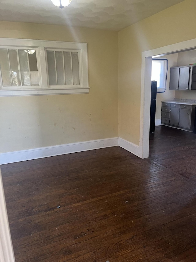 2816 10th St NW, Roanoke, VA 24012 - unfurnished room with dark wood-style floors and baseboards
