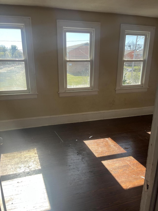 2816 10th St NW, Roanoke, VA 24012 - unfurnished room with hardwood / wood-style floors, plenty of natural light, and baseboards