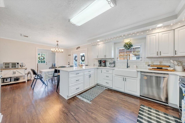 1028 Park Mountain Ter, Huddleston, VA 24104 - kitchen with stainless steel dishwasher, a textured ceiling, a peninsula, a sink, and ornamental molding