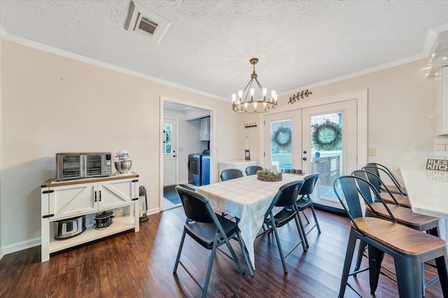 1028 Park Mountain Ter, Huddleston, VA 24104 - dining area with dark wood finished floors, a chandelier, french doors, crown molding, and a textured ceiling